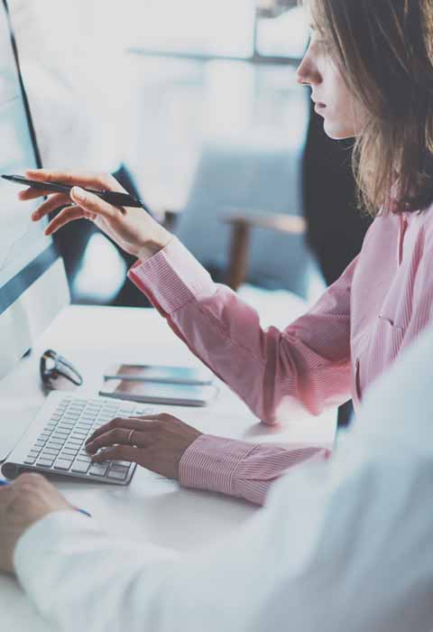 female working on computer for information systems